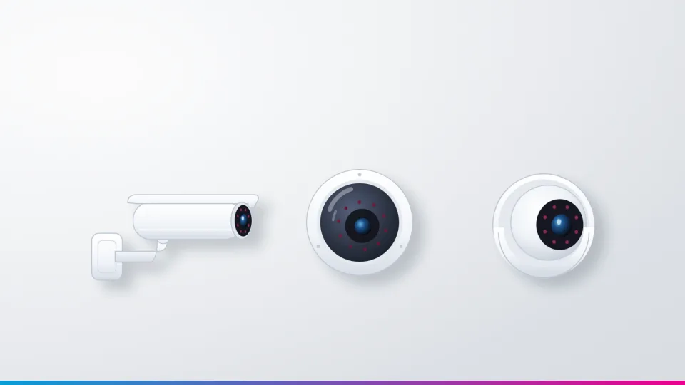 A bullet camera, a dome camera and a turret camera mounted side by side on a light grey wall